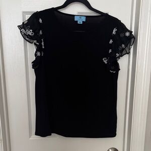 CeCe Black Top with White Floral Sleeves